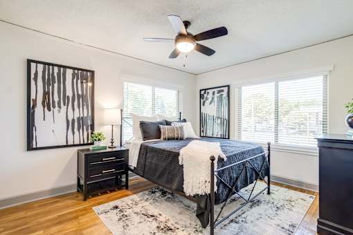 a bedroom with wood floors at Kiwi Goji Apartments, Memphis