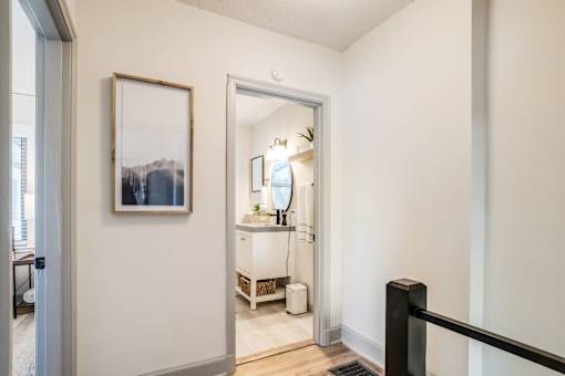 A bathroom with a white vanity and a mirror at Kiwi Goji Apartments, Memphis, TN,  38111