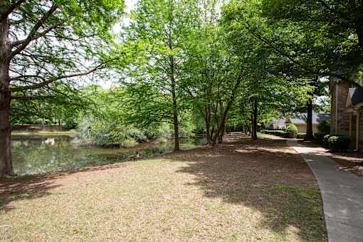 Park with a pond at Lakeside Villas Apartments, Hampton