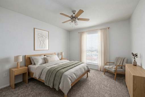 Bedroom with ceiling fan at Normandy Woods in Riviera East, Houston, TX, 77015