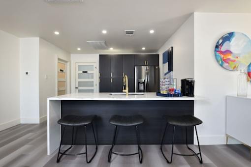 Kitchen with bar stool at Normandy Woods in Riviera East, Houston, TX, 77015