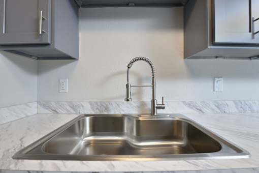 Stainless steel sink at Normandy Woods in Riviera East, Houston, TX, 77015