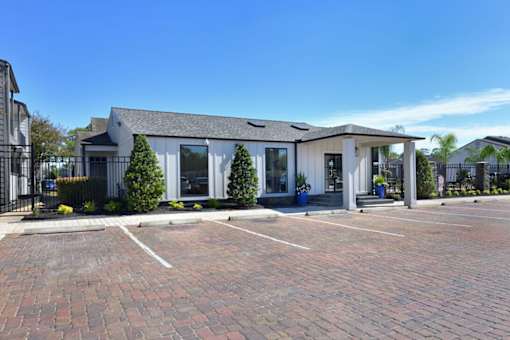 House exterior with parking lot at Normandy Woods in Riviera East, Houston, TX, 77015