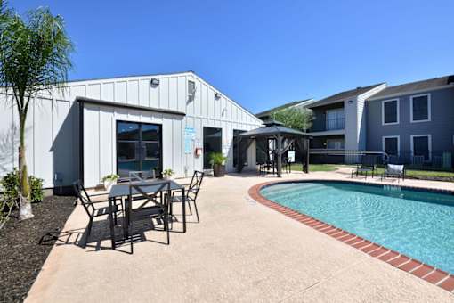 Poolside patio at Normandy Woods in Riviera East, Houston, TX, 77015