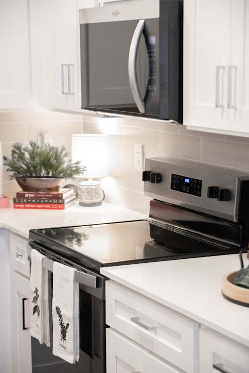 Kitchen with stove top oven at The One at Millington, Millington, TN, 38053