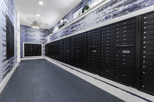 A long hallway with a wall of lockers on one side.