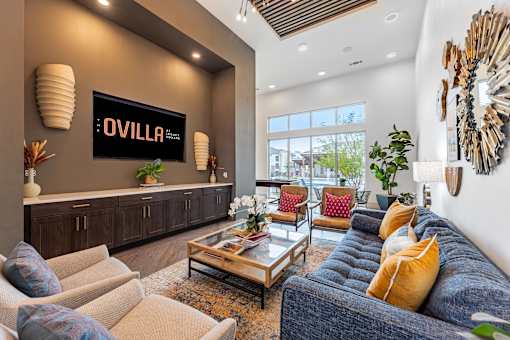 A living room with a large couch and a coffee table.