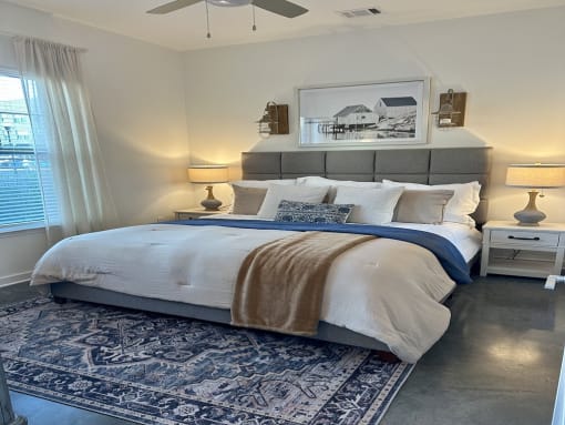 a bedroom with a bed and a window