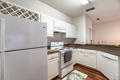 Kitchen with cabinets and appliances at Paradise Island, Florida, 32256
