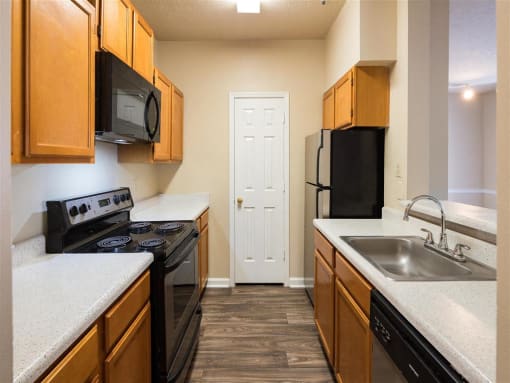 Stainless Steel Sink With Faucet In Kitchen at Park Summit Apartments, Decatur, Georgia