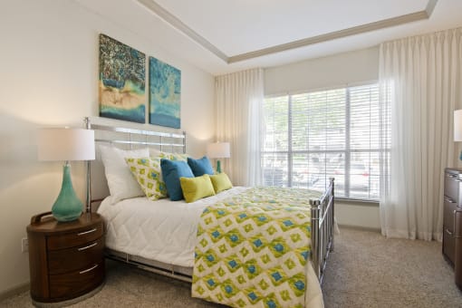 Bedroom in Model Apartment with Large Window located at St. Andrews Apartments in Johns Creek, GA 30022