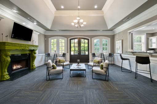 Modern Clubhouse with seating  located at St. Andrews Apartments in Johns Creek, GA 30022