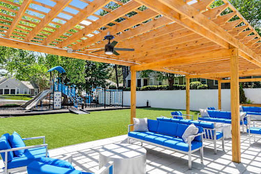A wooden pergola with a ceiling fan at Station Heights, Georgia 