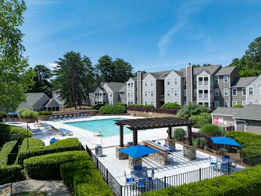 A swimming pool surrounded by a black fence at Station Heights, Alpharetta Georgia 