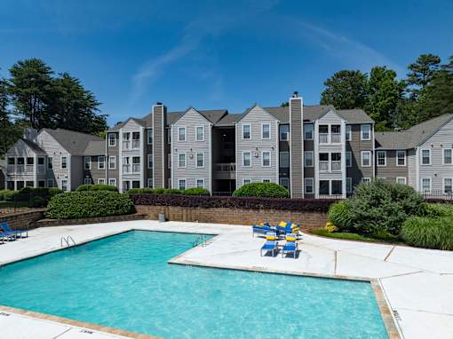 A swimming pool in front of a building at Station Heights, Alpharetta Georgia 