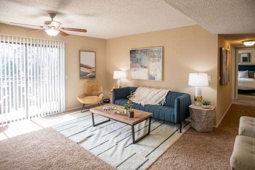 Living Room with a Blue Couch at Stewarts Ferry Apartments, Nashville, 37214