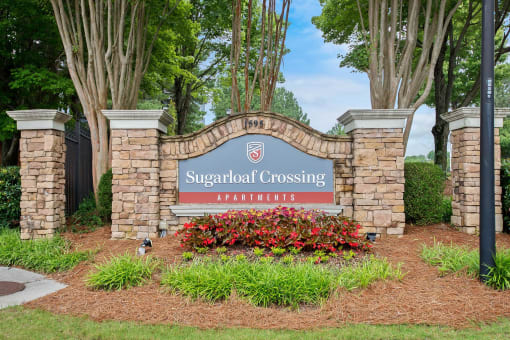 Welcoming Property Signage at Sugarloaf Crossing Apartments, Lawrenceville, 30046