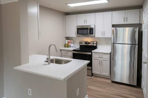 Kitchen with Refrigerator at Sugarloaf Crossing Apartments, Georgia