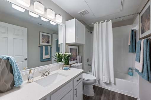 Bathroom with a white sink and a white toilet at The Ambrose, Houston, Texas