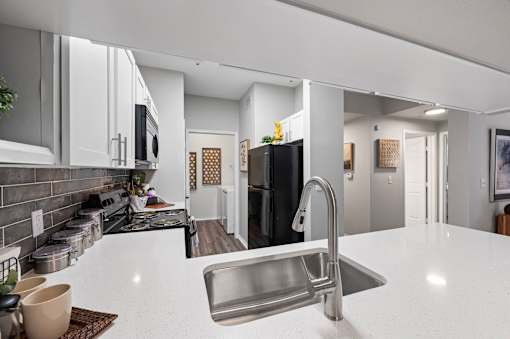 Fully Furnished Kitchen With Stainless Steel Appliances at The Ambrose, Houston, TX