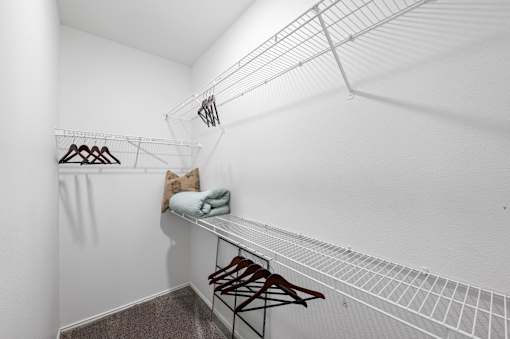 Walk-In Closets With Built-In Shelving at The Ambrose, Houston, 77040