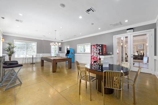 A room with a dining table and chairs at The Fenwick Apartments, Texas 77396