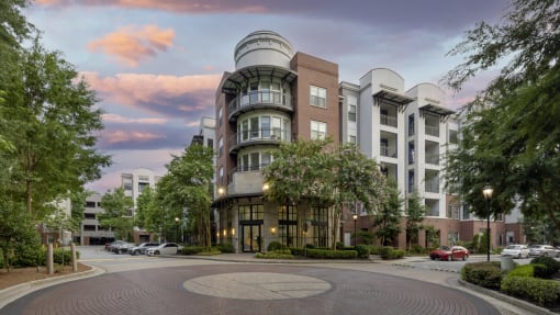 an exterior view of an apartment building on a city street at The Haven, Atlanta, GA