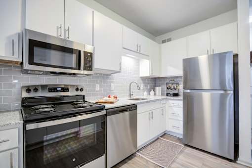 Kitchen with Black oven at The Waters at Chenal Apartments, Little Rock