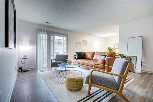 Living Room with Chair at The Waters at Chenal Apartments, Little Rock