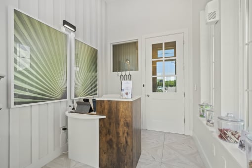 a bathroom with a sink and two mirrors at Livano Trinity Apartments, Nashville, TN