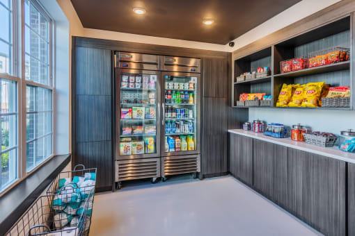 a pantry with two refrigerators and two shelves of food at The Livano Tryon, Charlotte, 28213