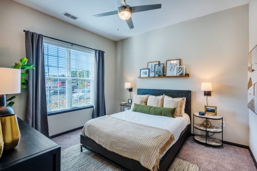 a bedroom with a large window and a ceiling fan at The Livano Tryon, Charlotte, North Carolina