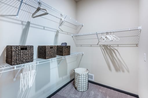a spacious walk in closet with plenty of room to hang clothes at The Livano Tryon, Charlotte, 28213