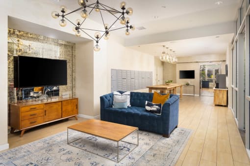 a living room filled with furniture and a large chandelier