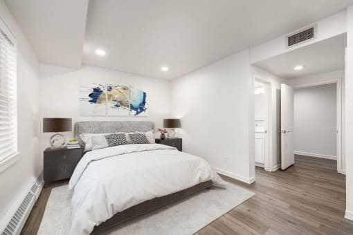 Bedroom with hardwood flooring and white walls