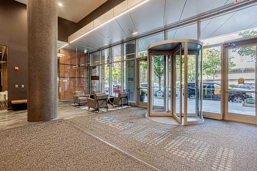 A hallway with a carpet that has the word "STAFF" on it.