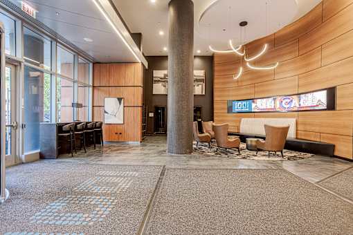 A conference room with a long table and chairs.