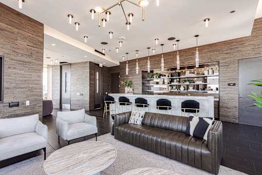 A modern living room with a long couch and a coffee table.