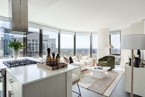A modern kitchen with a view of the city.