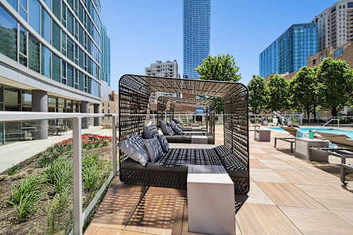 Resort-style pool deck with private cabanas at a luxury South Loop Chicago apartment building near downtown.