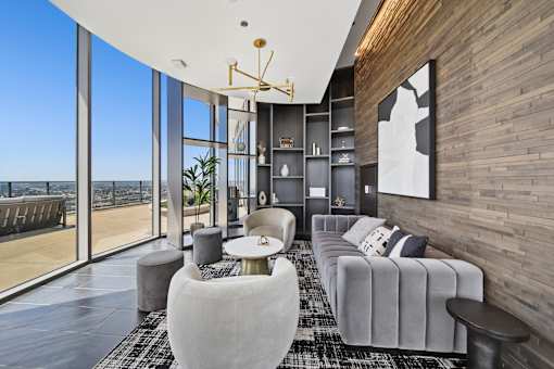 Stylish resident lounge with floor-to-ceiling windows and skyline views in South Loop Chicago apartments