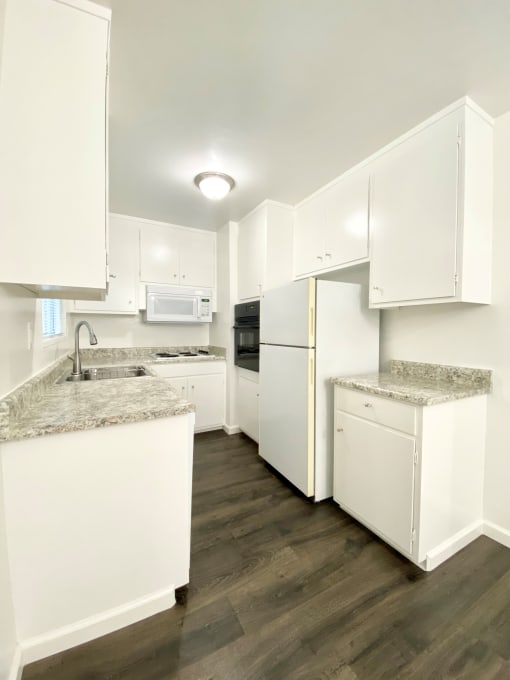 Kitchen With White Cabinetry And Appliances at 2120 Valerga Drive Belmont, California, 94002