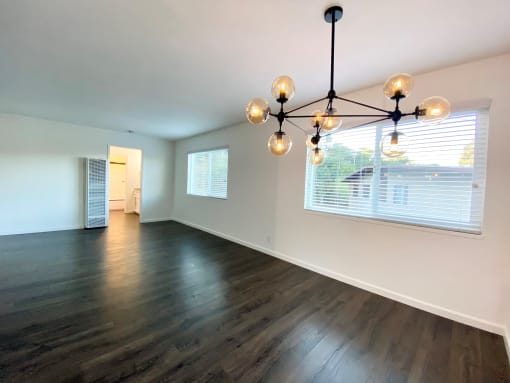 Stunning Living Room with Hardwood Floors, Modern Lighting, and Large Windows at 2120 Valerga in Belmont, CA 94002