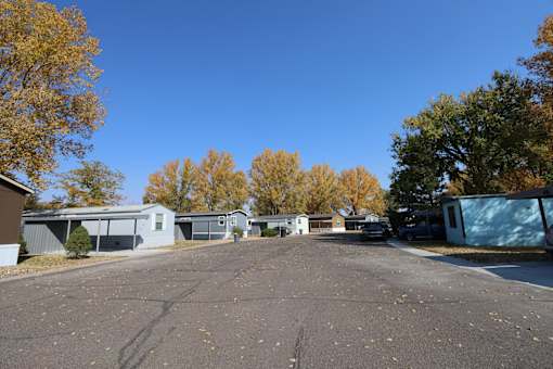 an empty street in a mobile home park with trees at Circle Park, Wyoming, 82007