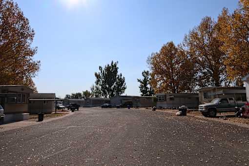 a parking lot filled with rows of mobile homes in a park at Circle Park, Cheyenne, 82007