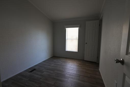 an empty room with a door and a window at Circle Park, Cheyenne, WY
