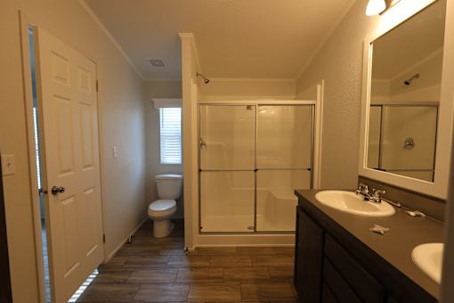 a bathroom with a shower and a sink and a toilet at Circle Park, Cheyenne, 82007