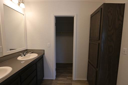 a bathroom with a sink and a mirror and a closet at Circle Park, Wyoming