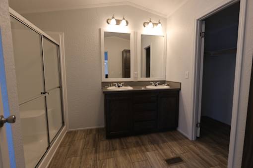a bathroom with two sinks and a shower at Circle Park, Cheyenne, 82007