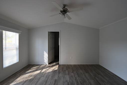 an empty living room with a ceiling fan and a window at Circle Park, Wyoming, 82007